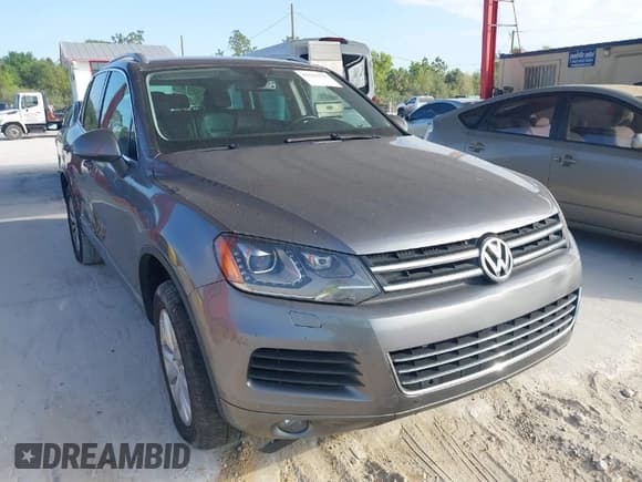 ✅ 2011 Volkswagen Touareg Sport • VIN: WVGFF9BP7BD000253 • Lot: 41512125. Listed on IAAI with 152,711 mi. Free auction sales archive from the USA and detailed vehicle history report at DreamBid. Image 1.