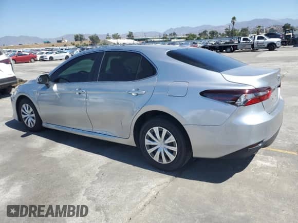 2021 Toyota Camry Hybrid LE with VIN 4T1C31AK8MU549059, listed as a Copart auction lot 71496045 with 84,184 mi miles and Salvage title. Bid and sale history available at DreamBid. Image 2.