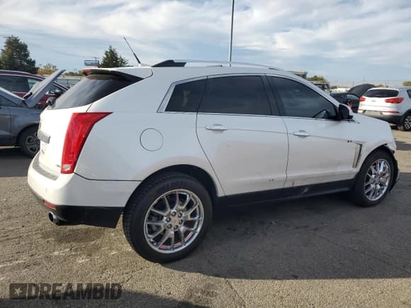 ✅ 2014 Cadillac SRX Premium Collection • VIN: 3GYFNGE32ES658467 • Лот: 82778375. Опубликован ранее на Copart с пробегом 108 159 миль. Бесплатный доступ к архиву аукционных продаж из США и подробный отчёт об истории автомобиля на DreamBid. Изображение 3.