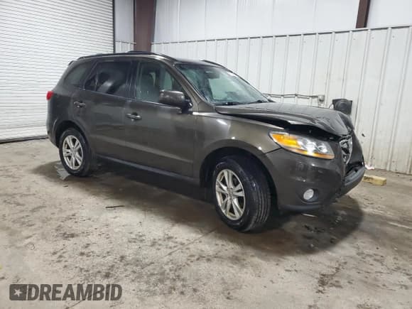 ✅ 2011 Hyundai Santa Fe SE • VIN: 5XYZHDAG8BG061824 • Lot: 77025964. Listed on Copart with 149,741 mi. Free auction sales archive from the USA and detailed vehicle history report at DreamBid. Image 4.