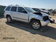 ✅ 2008 Jeep Grand Cherokee Laredo • VIN: 1J8GR48K18C124167 • Lot: 71770665. Wystawiony na Copart z przebiegiem 214 586 mil. Bezpłatny archiwum sprzedaży aukcyjnych z USA i szczegółowy raport historii pojazdu na DreamBid. Zdjęcie 4.