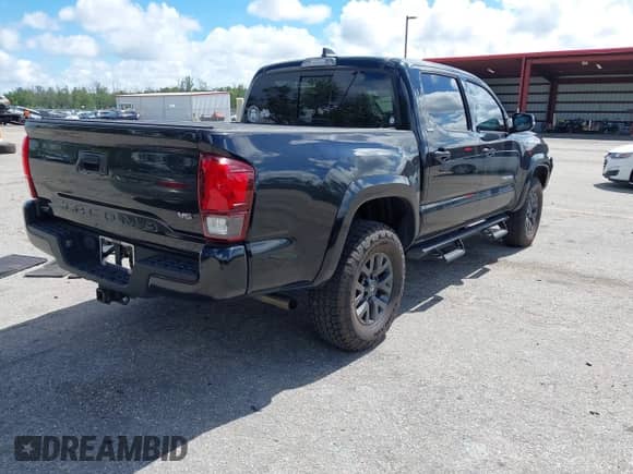 2022 Toyota Tacoma SR5 with VIN 3TMAZ5CN4NM164094, listed as a IAAI auction lot 43409274 with 38,585 mi miles and . Bid and sale history available at DreamBid. Image 4.