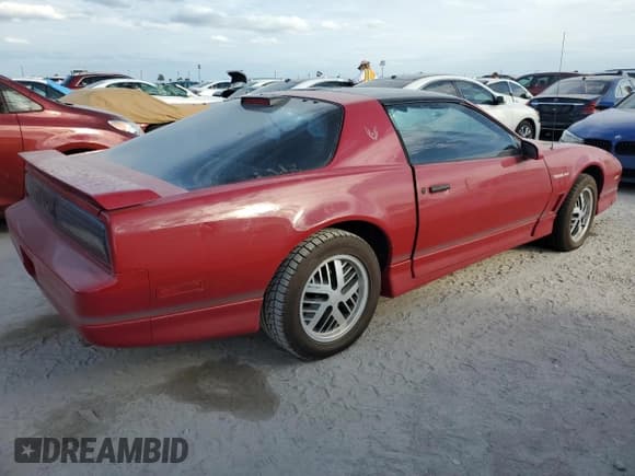 ✅ 1986 Pontiac Firebird Trans Am • VIN: 1G2FW87H0GL249284 • Lot: 76317174. Listed on Copart with 142,505 mi. Free auction sales archive from the USA and detailed vehicle history report at DreamBid. Image 3.