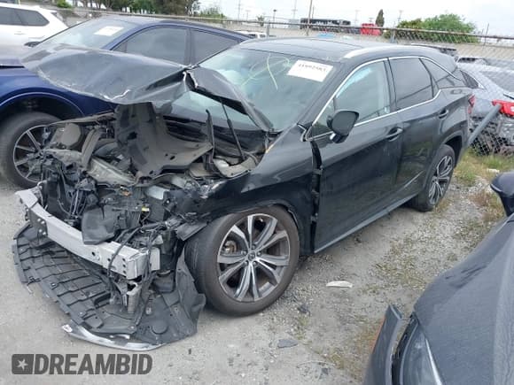 ✅ 2022 Lexus RX 350L • VIN: JTJHZKFA8N2038704 • Lot: 41892583. Listed on IAAI with 35,565 mi. Free auction sales archive from the USA and detailed vehicle history report at DreamBid. Image 2.