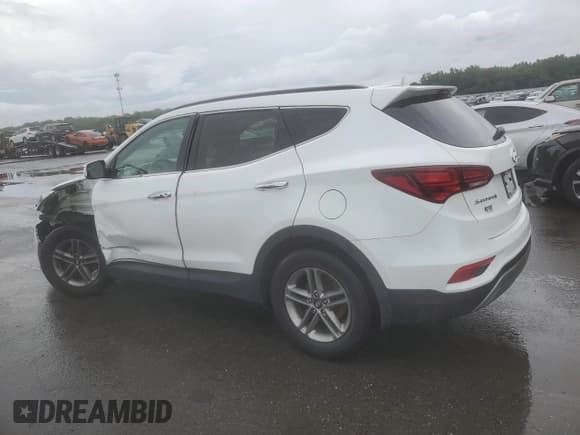 ✅ 2018 Hyundai Santa Fe 2.4L • VIN: 5NMZUDLB4JH062759 • Лот: 62489974. Опубликован ранее на Copart с пробегом 122 778 миль. Бесплатный доступ к архиву аукционных продаж из США и подробный отчёт об истории автомобиля на DreamBid. Изображение 2.