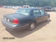✅ 1999 Ford Crown Victoria LX • VIN: 2FAFP74W6XX119265 • Lot: 42979924. Listed on IAAI with 115,216 mi. Free auction sales archive from the USA and detailed vehicle history report at DreamBid. Image 4.