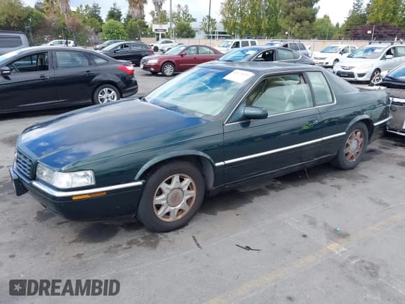 ✅ 1998 Cadillac Eldorado Touring • VIN: 1G6ET1299WU613236 • Lot: 43173727. Listed on IAAI with 165,556 mi. Free auction sales archive from the USA and detailed vehicle history report at DreamBid. Image 2.