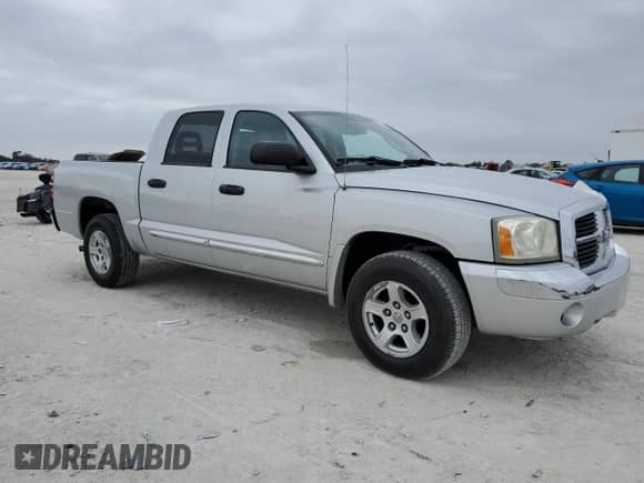 2006 Dodge Dakota Laramie with VIN 1D7HE58N06S641184, listed as a Copart auction lot 43596945 with 173,809 mi miles and Salvage title. Bid and sale history available at DreamBid. Image 4.