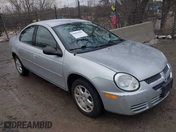 2005 Dodge Neon SXT z VIN 1B3ES56C05D253285, wystawiony jako IAAI lot #41651901 z przebiegiem 69 800 mil mil oraz . Historia ofert i sprzedaży dostępna na DreamBid. Obrazek 1.