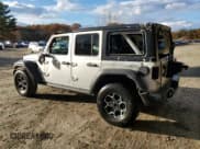 ✅ 2023 Jeep Wrangler Rubicon • VIN: 1C4JJXR61PW630974 • Lot: 90245445. Listed on Copart with 57,589 mi. Free auction sales archive from the USA and detailed vehicle history report at DreamBid. Image 2.