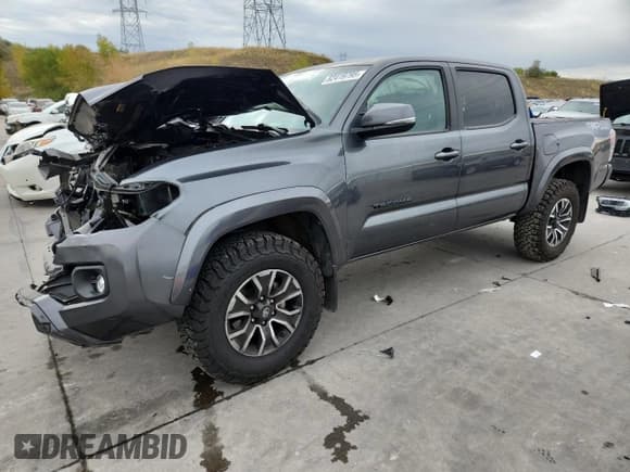 ✅ 2023 Toyota Tacoma TRD Sport • VIN: 3TMCZ5AN1PM557548 • Лот: 82419795. Опубликован ранее на Copart с пробегом 58 725 миль. Бесплатный доступ к архиву аукционных продаж из США и подробный отчёт об истории автомобиля на DreamBid. Изображение 1.