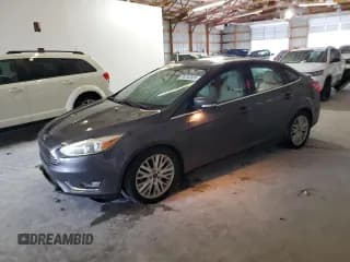 ✅ 2018 Ford Focus Titanium • VIN: 1FADP3J21JL316897 • Lot: 90242585. Listed on Copart with 132,305 mi. Free auction sales archive from the USA and detailed vehicle history report at DreamBid. Image 1.