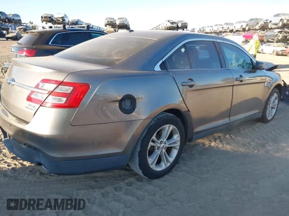 ✅ 2014 Ford Taurus SEL • VIN: 1FAHP2E81EG123593 • Lot: 43607478. Listed on IAAI with 200,101 mi. Free auction sales archive from the USA and detailed vehicle history report at DreamBid. Image 4.