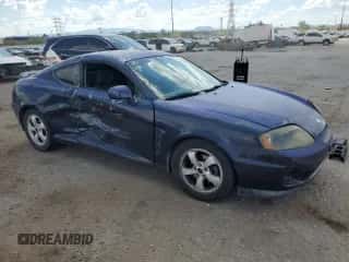 2006 Hyundai Tiburon GS с VIN KMHHM65D26U218704, выставлен на аукционе Copart как лот 80553255 с пробегом 211 718 миль миль и Списание • Salvage title. История ставок и продаж доступна на DreamBid. Изображение 4.