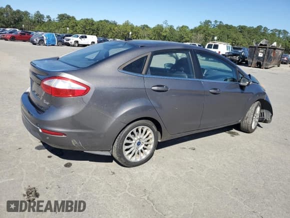 ✅ 2014 Ford Fiesta Titanium • VIN: 3FADP4CJ2EM232988 • Lot: 87364135. Wystawiony na Copart z przebiegiem 148 880 mil. Bezpłatny archiwum sprzedaży aukcyjnych z USA i szczegółowy raport historii pojazdu na DreamBid. Zdjęcie 3.