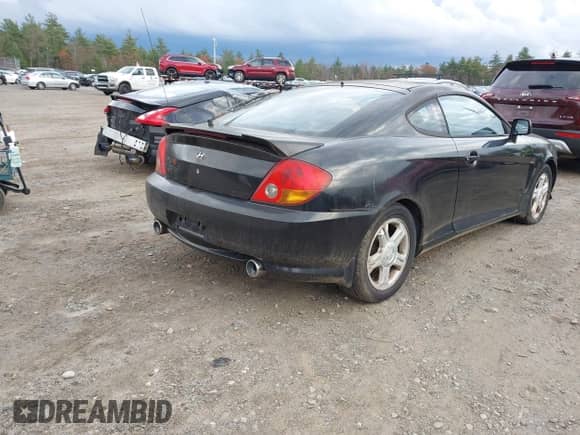 2003 Hyundai Tiburon GT with VIN KMHHN65F53U059705, listed as a IAAI auction lot 43573043 with 165,650 mi miles and . Bid and sale history available at DreamBid. Image 4.