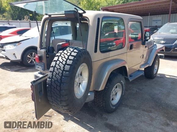 ✅ 2004 Jeep Wrangler Sahara • VIN: 1J4FA59S74P718659 • Lot: 43316154. Listed on IAAI with 144,737 mi. Free auction sales archive from the USA and detailed vehicle history report at DreamBid. Image 4.