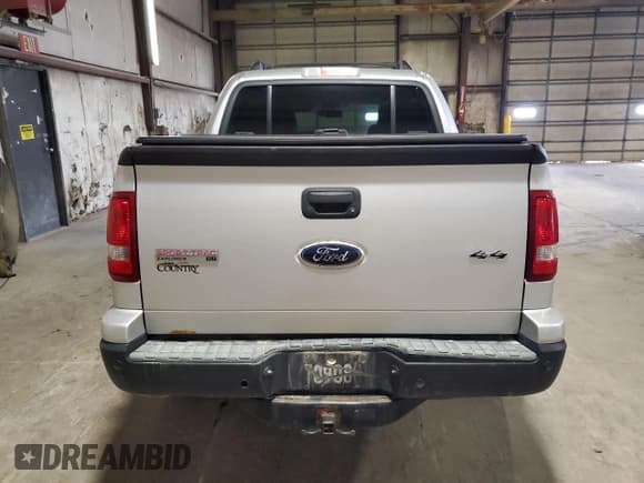 ✅ 2010 Ford Explorer Sport Trac XLT • VIN: 1FMEU5BE5AUF03013 • Лот: 67212825. Опубликован ранее на Copart с пробегом 129 668 миль. Бесплатный доступ к архиву аукционных продаж из США и подробный отчёт об истории автомобиля на DreamBid. Изображение 6.