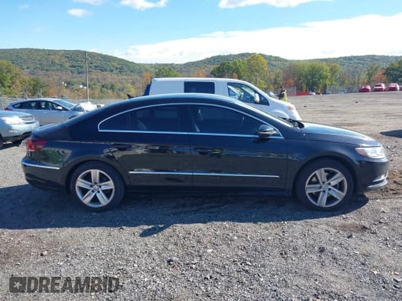 ✅ 2014 Volkswagen CC Sport • VIN: WVWBP7AN4EE504228 • Lot: 43429571. Listed on IAAI with 101,143 mi. Free auction sales archive from the USA and detailed vehicle history report at DreamBid. Image 13.