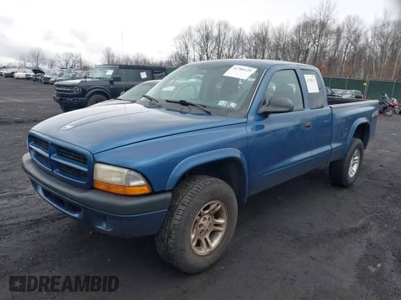 2003 Dodge Dakota Sport z VIN 1D7HG32NX3S322085, wystawiony jako IAAI lot #41780125 z przebiegiem 95 321 mil mil oraz . Historia ofert i sprzedaży dostępna na DreamBid. Obrazek 2.
