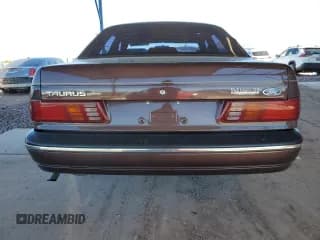 ✅ 1988 Ford Taurus LX • VIN: 1FABP5345JG210480 • Лот: 50248585. Опубликован ранее на Copart с пробегом 47 172 миль. Бесплатный доступ к архиву аукционных продаж из США и подробный отчёт об истории автомобиля на DreamBid. Изображение 6.