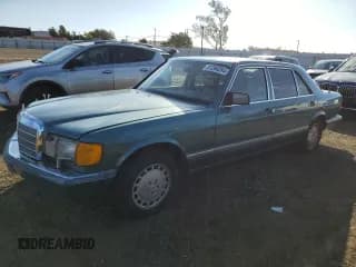 ✅ 1989 Mercedes-Benz 420 SEL • VIN: WDBCA35EXKA489275 • Лот: 81286284. Опубликован ранее на Copart с пробегом 154 137 миль. Бесплатный доступ к архиву аукционных продаж из США и подробный отчёт об истории автомобиля на DreamBid. Изображение 1.