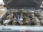 ✅ 1998 Jeep Cherokee Sport • VIN: 1J4FJ68S9WL241184 • Lot: 87360684. Listed on Copart with 257,954 mi. Free auction sales archive from the USA and detailed vehicle history report at DreamBid. Image 11.