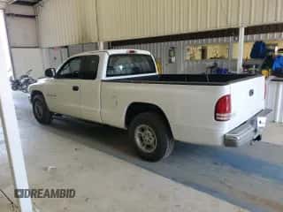 2000 Dodge Dakota z VIN 1B7GL22X5YS571012, wystawiony jako Copart lot #67688924 z przebiegiem 141 562 mil mil oraz Szkoda całkowita • Salvage title. Historia ofert i sprzedaży dostępna na DreamBid. Obrazek 2.