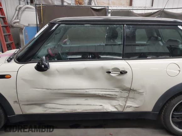 ✅ 2006 MINI Hardtop • VIN: WMWRC33506TK15034 • Lot: 42349957. Listed on IAAI with 153,596 mi. Free auction sales archive from the USA and detailed vehicle history report at DreamBid. Image 14.