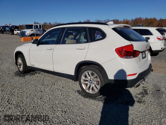 ✅ 2015 BMW X1 xDrive28i • VIN: WBAVL1C58FVY37517 • Lot: 90432745. Listed on Copart with 107,165 mi. Free auction sales archive from the USA and detailed vehicle history report at DreamBid. Image 2.