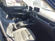 ✅ 2023 Mazda CX-5 S Carbon Edition • VIN: JM3KFBCMXP0282649 • Lot: 42784337. Listed on IAAI with 25,589 mi. Free auction sales archive from the USA and detailed vehicle history report at DreamBid. Image 5.