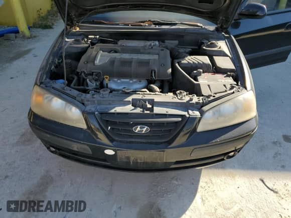 2006 Hyundai Elantra GLS z VIN KMHDN56D56U184066, wystawiony jako Copart lot #77399094 z przebiegiem 101 818 mil mil oraz Szkoda całkowita • Salvage title. Historia ofert i sprzedaży dostępna na DreamBid. Obrazek 11.