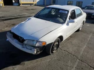✅ 1999 Mazda 626 LX • VIN: 1YVGF22D4X5882600 • Lot: 69031604. Wystawiony na Copart z przebiegiem Nie podano. Bezpłatny archiwum sprzedaży aukcyjnych z USA i szczegółowy raport historii pojazdu na DreamBid. Zdjęcie 1.