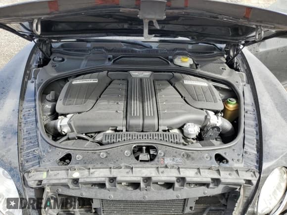 ✅ 2013 Bentley Continental GT • VIN: SCBFC7ZA1DC085606 • Лот: 82767884. Опубликован ранее на Copart с пробегом 99 327 миль. Бесплатный доступ к архиву аукционных продаж из США и подробный отчёт об истории автомобиля на DreamBid. Изображение 11.