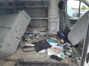 ✅ 2015 Ford Transit Cargo • VIN: 1FTNR1YM9FKA13366 • Лот: 57946755. Опубликован ранее на Copart с пробегом 129 500 миль. Бесплатный доступ к архиву аукционных продаж из США и подробный отчёт об истории автомобиля на DreamBid. Изображение 11.