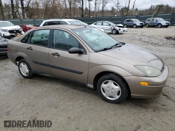 ✅ 2004 Ford Focus LX • VIN: 1FAFP33Z74W132828 • Lot: 45993904. Listed on Copart with 104,735 mi. Free auction sales archive from the USA and detailed vehicle history report at DreamBid. Image 4.