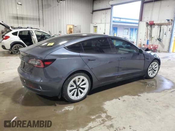 ✅ 2022 Tesla Model 3 • VIN: 5YJ3E1EA0NF331028 • Lot: 92853625. Listed on Copart with 15,584 mi. Free auction sales archive from the USA and detailed vehicle history report at DreamBid. Image 3.