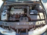 ✅ 1997 Saturn SC • VIN: 1G8ZF1286VZ266912 • Лот: 46953875. Опубликован ранее на Copart с пробегом 149 017 миль. Бесплатный доступ к архиву аукционных продаж из США и подробный отчёт об истории автомобиля на DreamBid. Изображение 11.