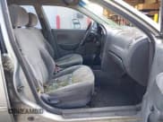 ✅ 2003 Kia Spectra • VIN: KNAFB121935242063 • Lot: 43067517. Listed on IAAI with 162,061 mi. Free auction sales archive from the USA and detailed vehicle history report at DreamBid. Image 5.