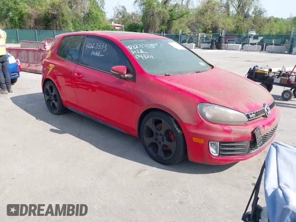 ✅ 2012 Volkswagen Golf GTI w/Conv & Sunroof • VIN: WVWEV7AJ2CW259338 • Lot: 42123333. Listed on IAAI with 121,365 mi. Free auction sales archive from the USA and detailed vehicle history report at DreamBid. Image 1.