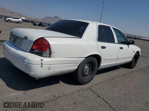 ✅ 2001 Ford Crown Victoria Police Interceptor • VIN: 2FAFP71W01X185449 • Lot: 70462294. Listed on Copart with 163,830 mi. Free auction sales archive from the USA and detailed vehicle history report at DreamBid. Image 3.