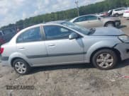 ✅ 2009 Kia Rio LX • VIN: KNADE223296459124 • Lot: 43130896. Wystawiony na IAAI z przebiegiem 129 998 mil. Bezpłatny archiwum sprzedaży aukcyjnych z USA i szczegółowy raport historii pojazdu na DreamBid. Zdjęcie 13.