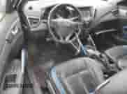 ✅ 2014 Hyundai Veloster Turbo • VIN: KMHTC6AE7EU185743 • Лот: 76017224. Размещён на Copart с пробегом 84 399 миль миль. Получите бесплатный доступ к архиву аукционных продаж из США и посмотрите подробный отчёт об истории автомобиля на DreamBid. Изображение 8.