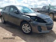 ✅ 2012 Mazda 3 i Touring • VIN: JM1BL1L8XC1686831 • Lot: 42373850. Listed on IAAI with 152,067 mi. Free auction sales archive from the USA and detailed vehicle history report at DreamBid. Image 1.