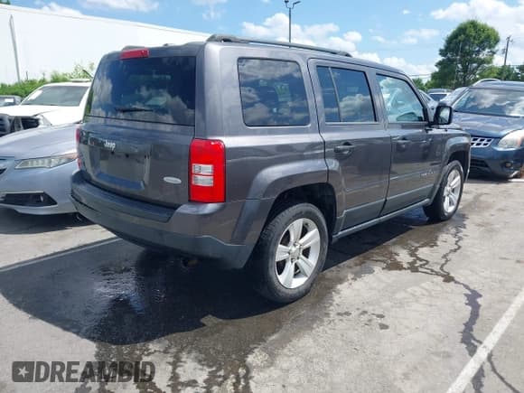 ✅ 2015 Jeep Patriot Latitude • VIN: 1C4NJPFB8FD419929 • Lot: 42315972. Listed on IAAI with 176,735 mi. Free auction sales archive from the USA and detailed vehicle history report at DreamBid. Image 4.