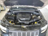 ✅ 2015 Jeep Grand Cherokee Overland • VIN: 1C4RJFCG7FC673181 • Lot: 46527875. Listed on Copart with 124,503 mi. Free auction sales archive from the USA and detailed vehicle history report at DreamBid. Image 14.