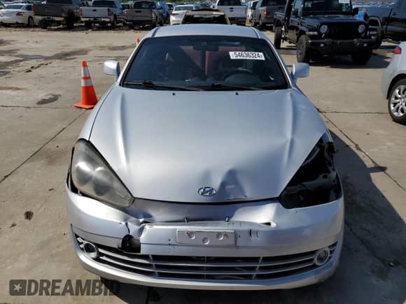 2008 Hyundai Tiburon GT z VIN KMHHN66F98U267849, wystawiony jako Copart lot #88506815 z przebiegiem 92 820 mil mil oraz Szkoda całkowita • Salvage title. Historia ofert i sprzedaży dostępna na DreamBid. Obrazek 5.