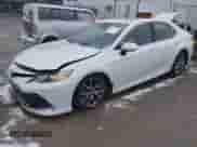 2022 Toyota Camry Hybrid XLE with VIN 4T1F31AK8NU575434, listed as a IAAI auction lot 41067498 with 11,052 mi miles and . Bid and sale history available at DreamBid. Image 2.