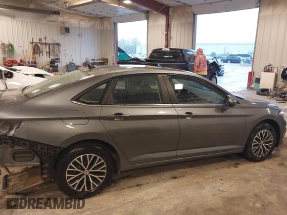 ✅ 2021 Volkswagen Jetta S • VIN: 3VWN57BU7MM102699 • Лот: 43376432. Опубликован ранее на IAAI с пробегом 23 175 миль. Бесплатный доступ к архиву аукционных продаж из США и подробный отчёт об истории автомобиля на DreamBid. Изображение 13.