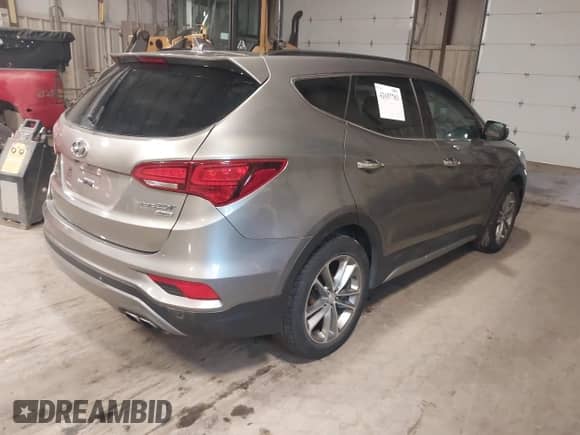 2017 Hyundai Santa Fe 2.0T z VIN 5XYZUDLA4HG424259, wystawiony jako IAAI lot #42657783 z przebiegiem 213 040 mil mil oraz . Historia ofert i sprzedaży dostępna na DreamBid. Obrazek 4.